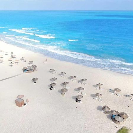 Tolip North Coast Hotel El Alamein Bagian luar foto Aerial view of the beach