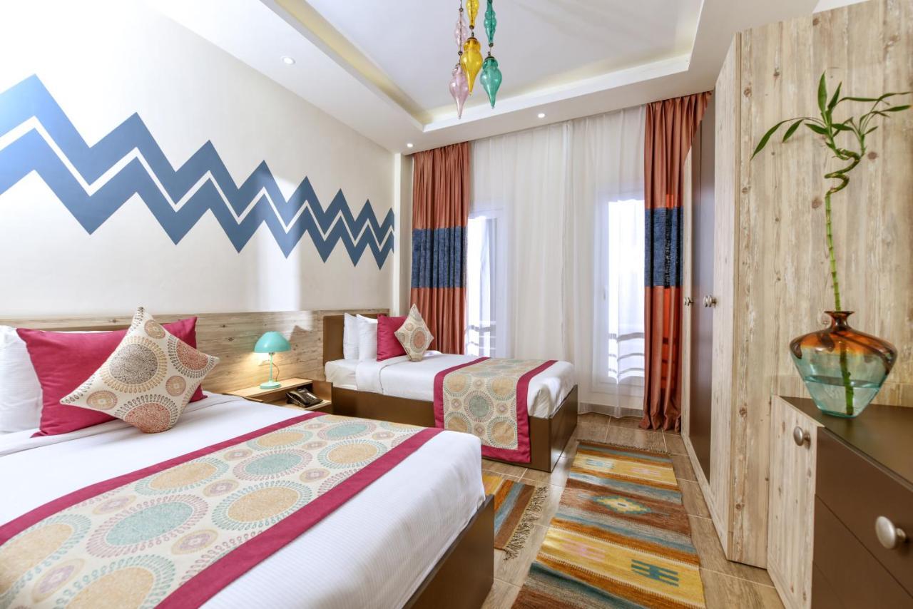 Tolip North Coast Hotel El Alamein Bagian luar foto A room at the hotel